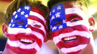 United States of America football team supporters wears Stars and Stripes face paint during the 1994 FIFA World Cup group A game between the United States and Colombia on 22nd June 1994 at the Rose Bowl, Pasadena, California, United States. USA won the match 2 - 1. (Photo by David Cannon/Allsport/Getty Images)