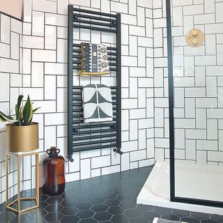 bathroom with white tiled walls and grey tiled flooring