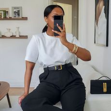 Three women wear the Saint Laurent Cassandre belt 