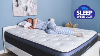 Woman sleeping on a new mattress in a brightly lit room