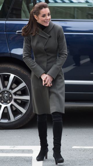 Princess of Wales walks away from her car as she visits Caernarfon in North Wales in 2015