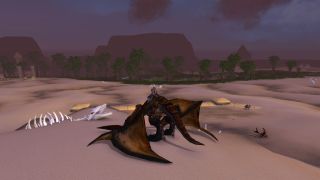 WoW Cataclysm map - a player is sat on a dragon mount in a desert in Uldum