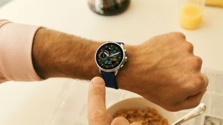 Fossil Gen 6 Wellness Edition on a person's wrist