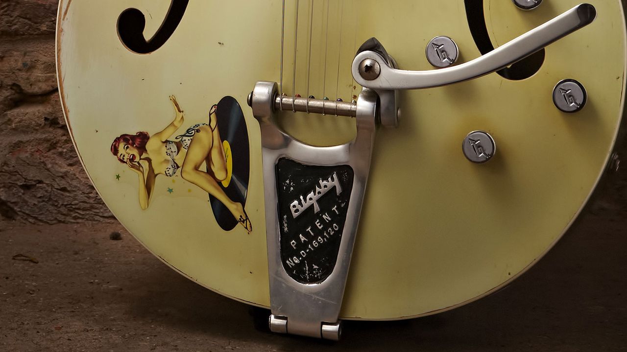This guitar's previous owner made a few upgrades, replacing the G-cutout tailpiece with a Bigsby