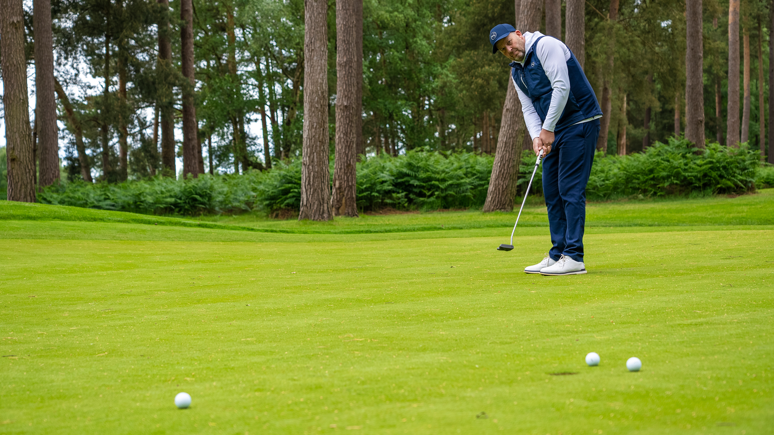 Golfer missing putt high to be closer to the hole