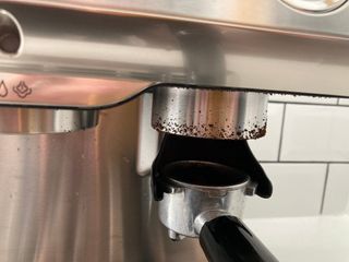 grinding coffee into the portafilter on the Ariete 1313 espresso maker