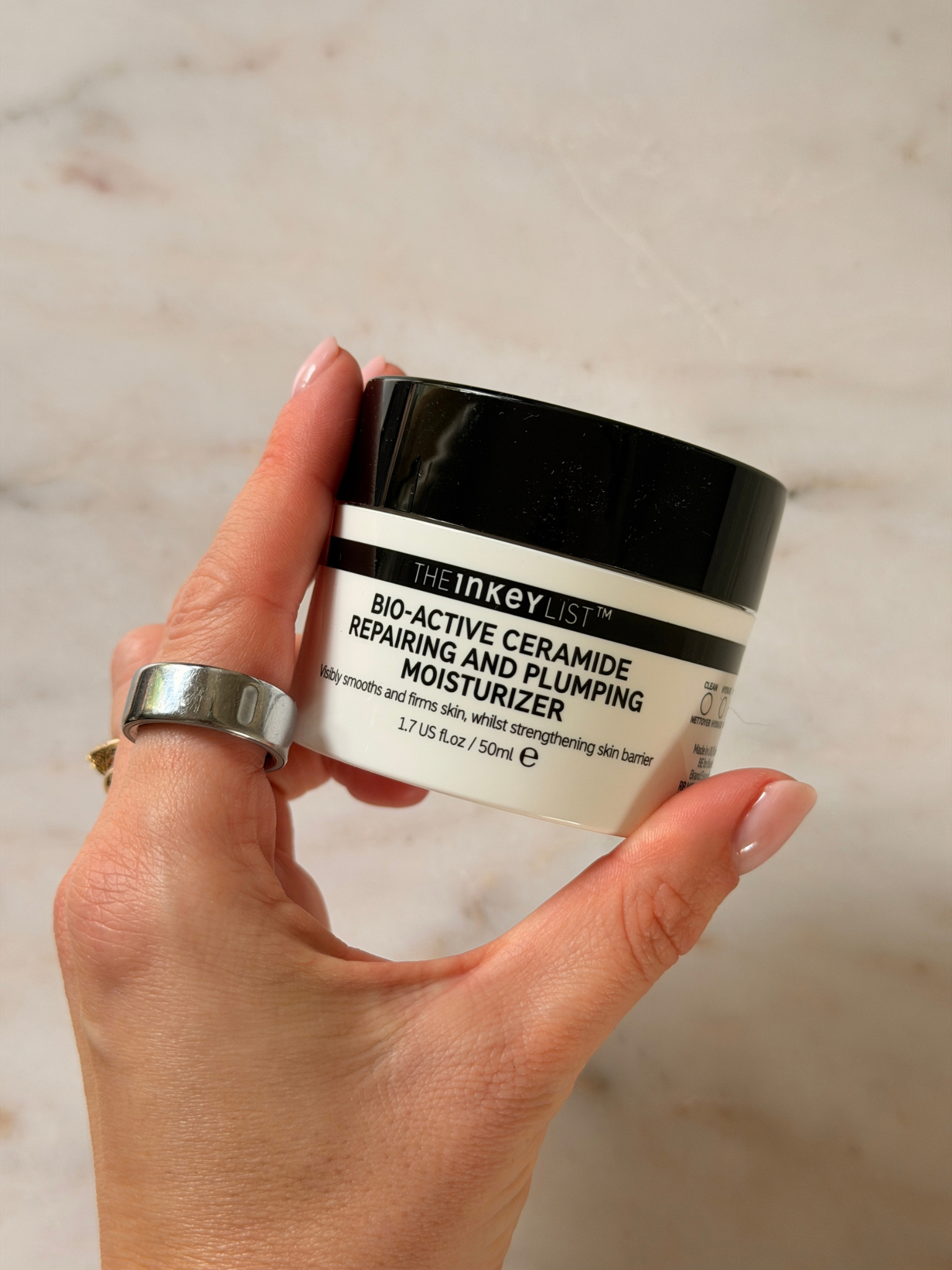Freelance beauty editor Grace Day holding the Inkey List moisturiser