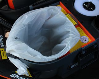 Using a small white trash bag inside the Shark MessMaster vacuum cleaner