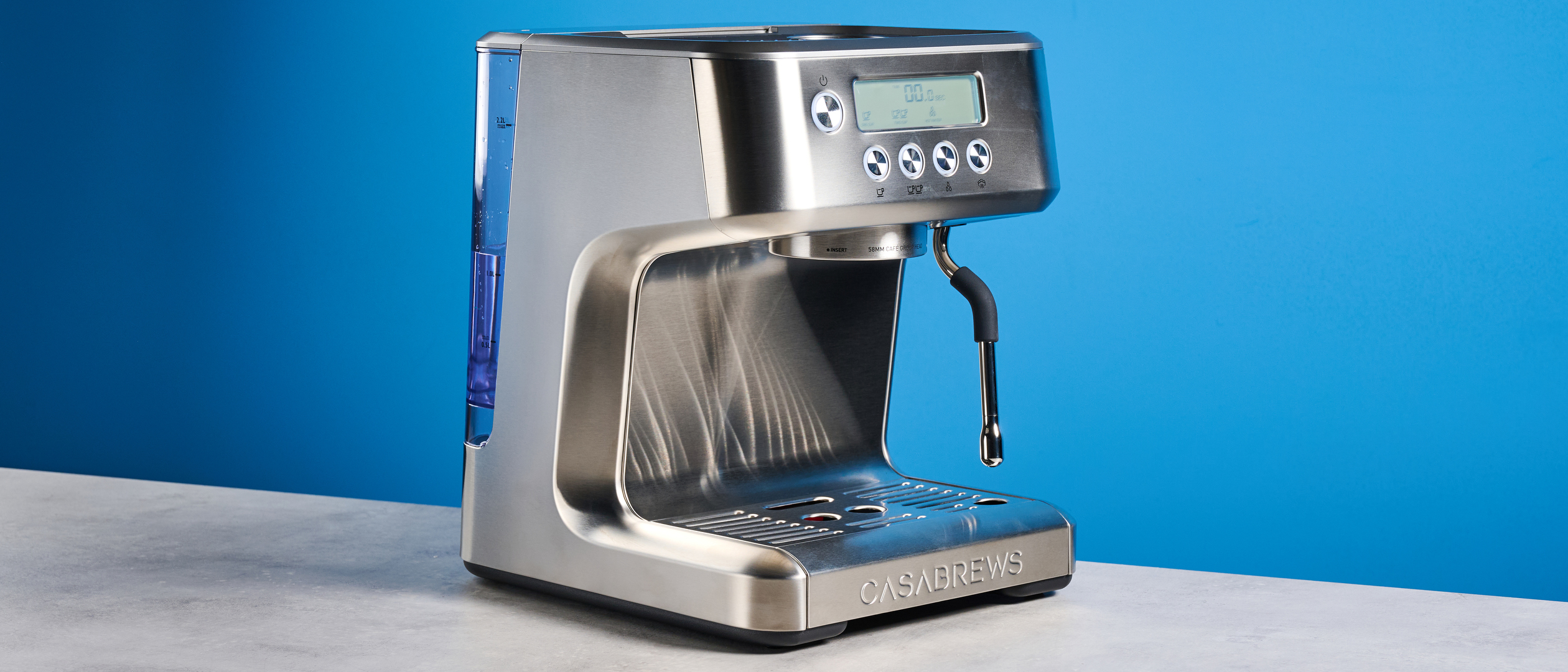 the casabrews ultra espresso machine with 20 bar pressure, a steam wand, LED screen, timer, and tamper accessories, photographed against a blue background