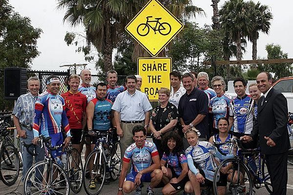 Cyclists show their support of the New Share the Road Sign
