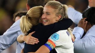 England's coach Sarina Wiegman (L) and England's midfielder Leah Williamson celebrate after winning at the end of the UEFA Women's Euro 2022 semi-final football match between England and Sweden at the Bramall Lane stadium, in Sheffield, on July 26, 2022. - England won 4 - 0 against Sweden.