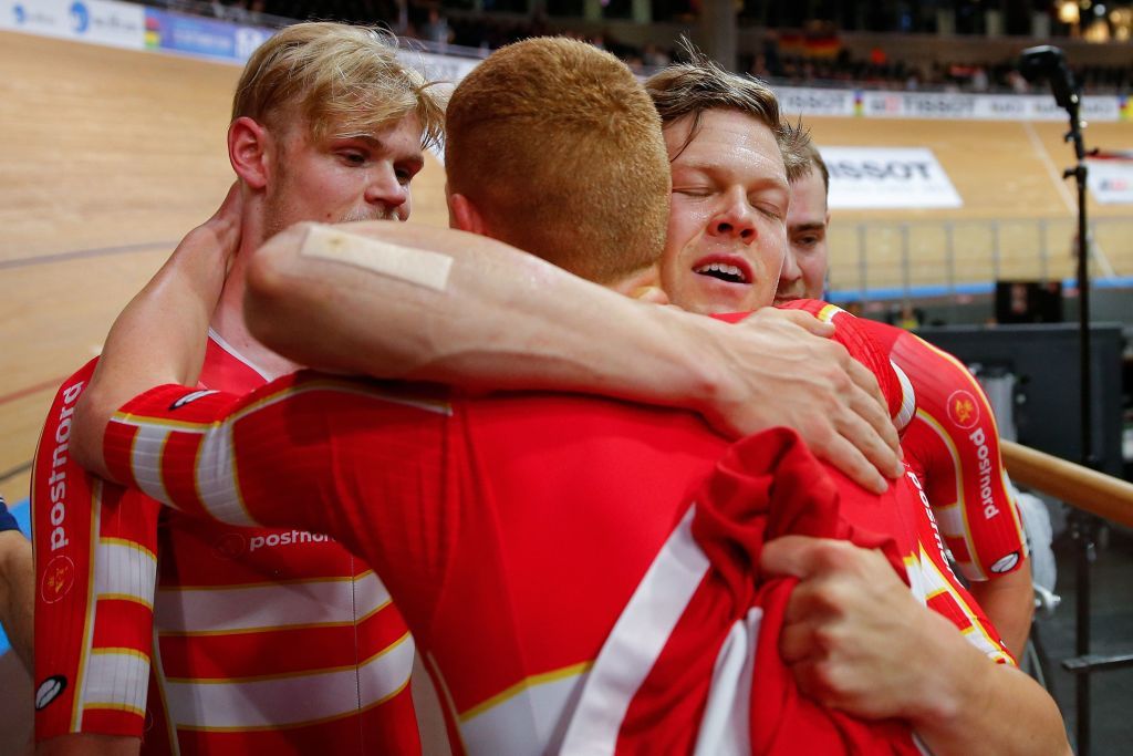 Denmarks Lasse Norman Hansen Denmarks Julius Johansen Denmarks Frederik Rodenberg Madsen and Denmarks Rasmus Pedersen celebrate Gold and a new World Record in the mens Team Pursuit Finals at the UCI track cycling World Championship at the velodrome in Berlin on February 27 2020 Photo by Odd ANDERSEN AFP Photo by ODD ANDERSENAFP via Getty Images