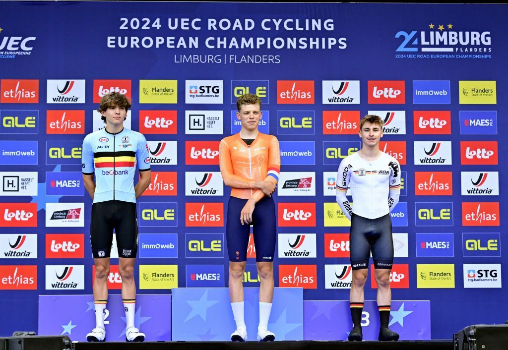 Belgian Jasper Schoofs , winner of the silver medal, Dutch Michiel Mouris winner of the gold medal and German Paul Fietzke , winner of the bronze medal pictured on the podium of the time trial junior men at the European Championship 2024, in Hasselt, Wednesday 11 September 2024. The UEC Road European Championships 2024 will take place from 11 to 15 september in Limburg, Belgium. BELGA PHOTO DIRK WAEM (Photo by DIRK WAEM / BELGA MAG / Belga via AFP)