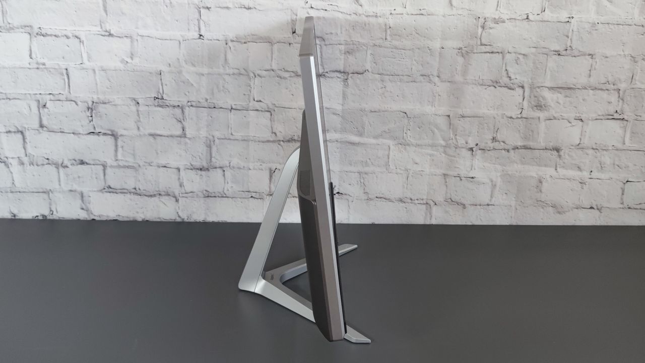A side-on photograph of the Acer Aspire C24 on a desk