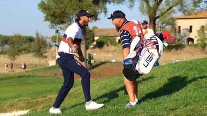 Ryder Cup Day 3 live stream Max Homa of Team United States and caddie, Joe Greiner celebrate on the 15th green during the Saturday afternoon fourball matches of the 2023 Ryder Cup