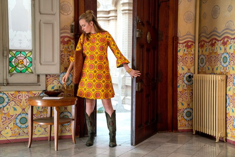Clothing, Yellow, Fashion, Dress, Textile, Outerwear, Visual arts, Room, Sleeve, Pattern,