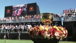 An image from "Full Swing" on Netflix showing the Presidents Cup surrounded by flowers