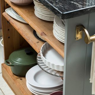 Kitchen shelves with plates and cookware