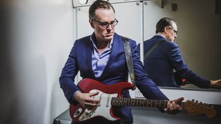 Portrait of American blues rock musician Joe Bonamassa, photographed before a live performance at Plymouth Pavilions in Devon, on March 21, 2016.