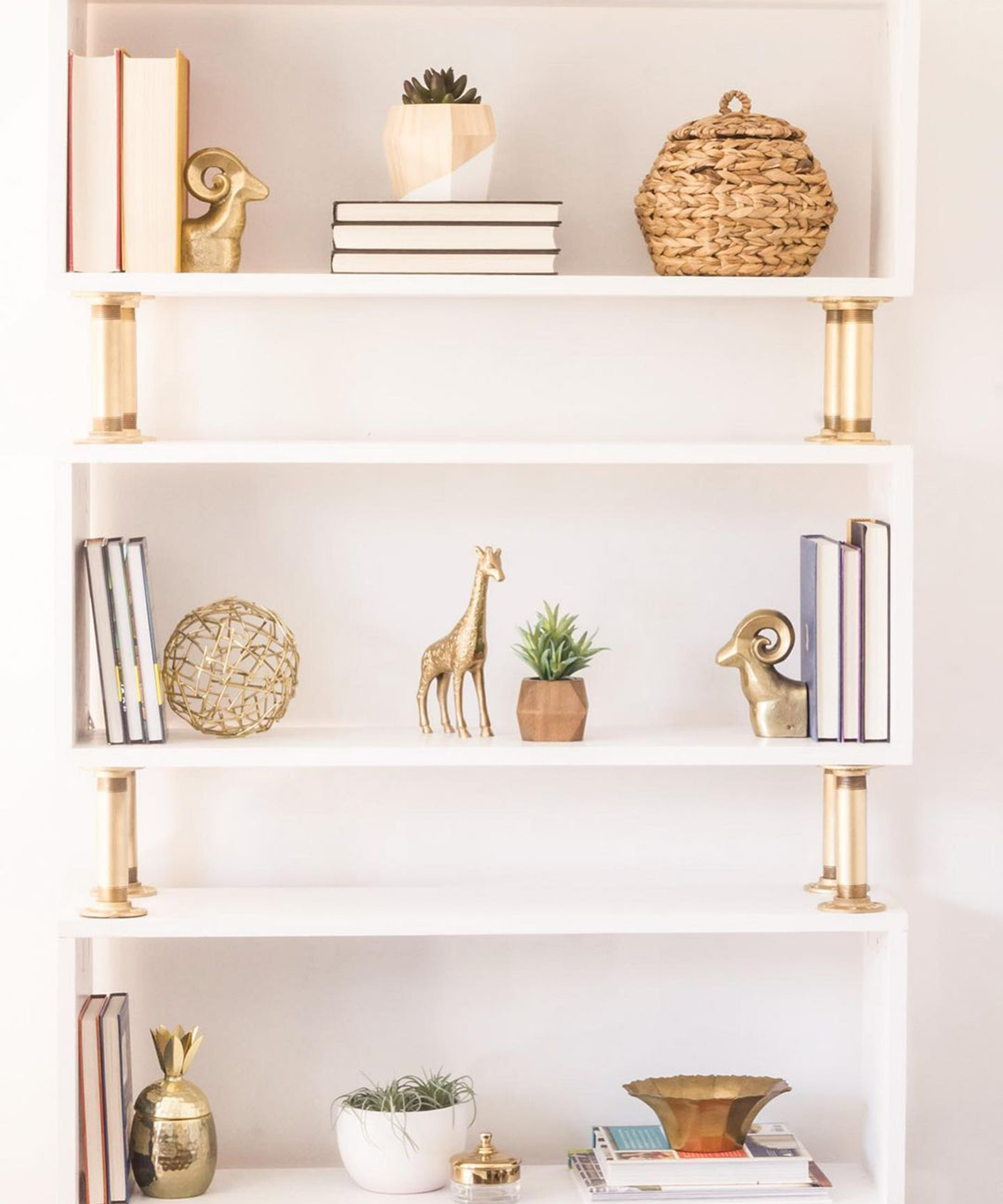 A white and gold-colored DIY bookcase