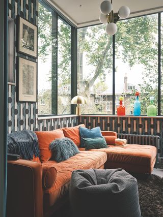 reading corner with orange sectional sofa