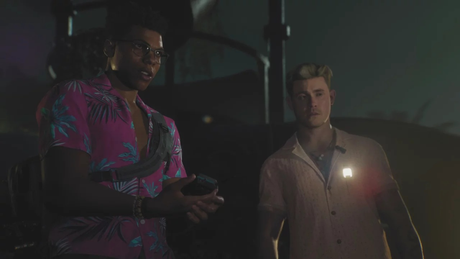 Two characters in bright shirts stand in the dark of night in Until Dawn 2