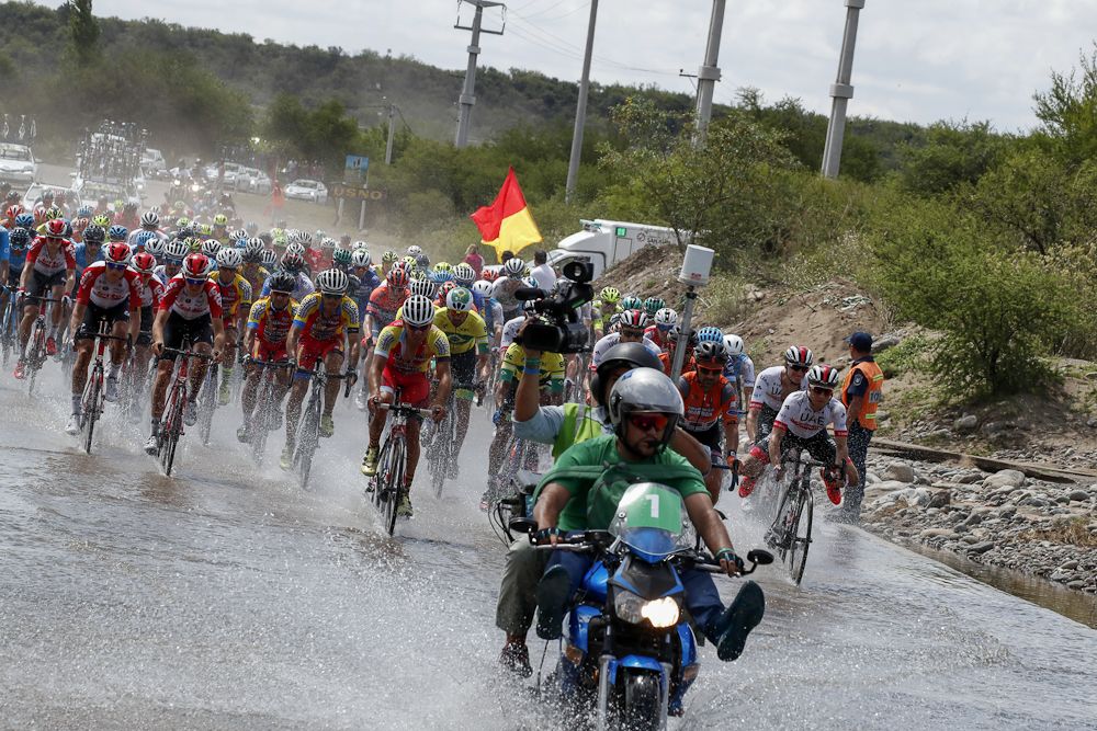 The peloton navigates some high water 10km from the finish of stage 4 in San Juan