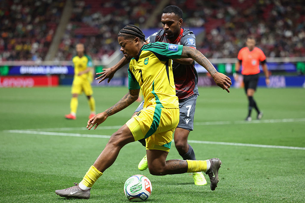 Jamaica's midfielder #07 Leon Bailey and New Caledonia's midfielder #07 Jekob Jeno fight for the ball during the 2026 FIFA World Cup qualifiers semi-final playoff football match between New Caledonia and Jamaica at the Akron Stadium in Zapopan, Mexico on March 26, 2026. (Photo by Ulises Ruiz / AFP)