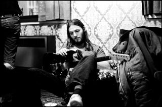 David Gilmour backstage during the Dark Side Of The Moon tour in 1974. I think this was taken in the Usher Hall Edinburgh in Nov 1974. I love the faded grandeur of the flocked wall paper and velvet furniture