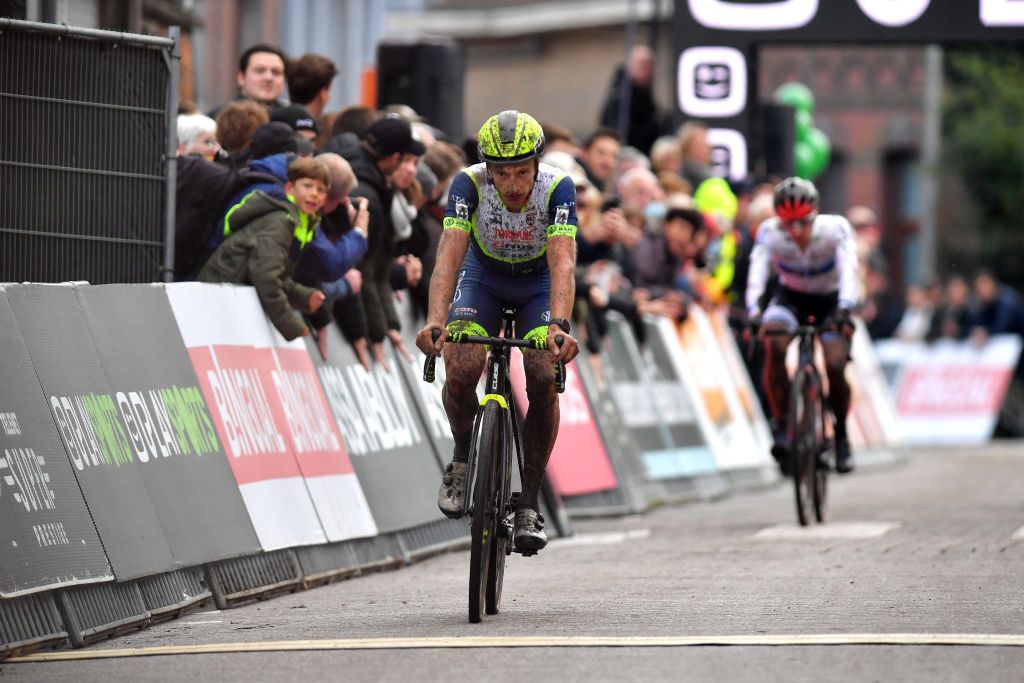 NIEL BELGIUM NOVEMBER 11 Quinten Hermans of Belgium and TormansCircus Cyclo Cross Team crosses the finishing line on third place during the 30th Superprestige Niel Jaarmarktcross 2021 Mens Elite SPNiel Superprestige2022 on November 11 2021 in Niel Belgium Photo by Luc ClaessenGetty Images