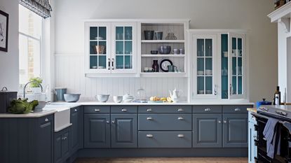 blue and white kitchen with white panel splashback