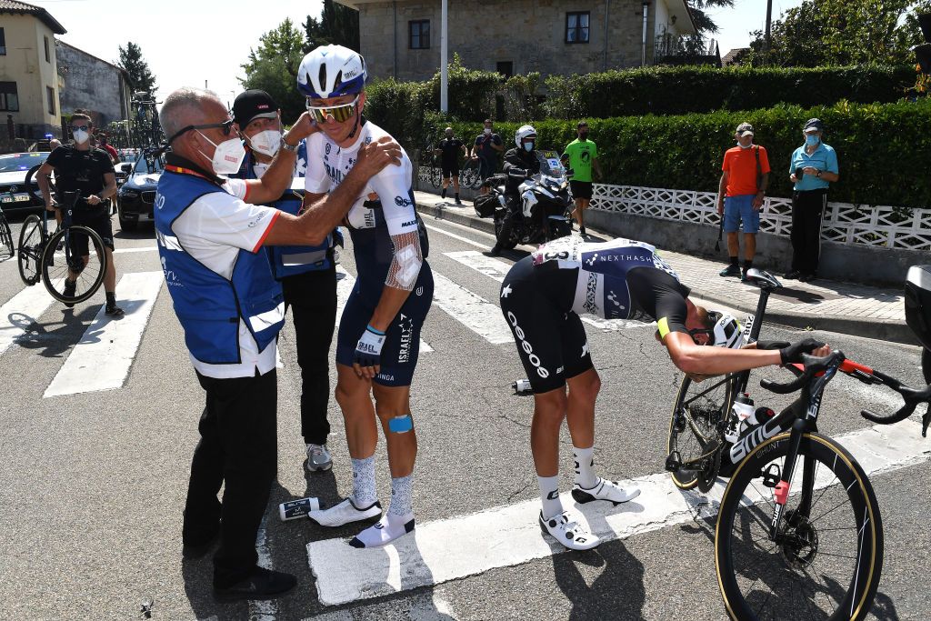 SANTA CRUZ DE BEZANA SPAIN AUGUST 31 LR Sep Vanmarcke of Belgium and Team Israel StartUp Nation and Dylan Sunderland of Australia and Team Qhubeka Nexthash injured after crash during the 76th Tour of Spain 2021 Stage 16 a 180km stage from Laredo to Santa Cruz de Bezana lavuelta LaVuelta21 on August 31 2021 in Santa Cruz de Bezana Spain Photo by Tim de WaeleGetty Images