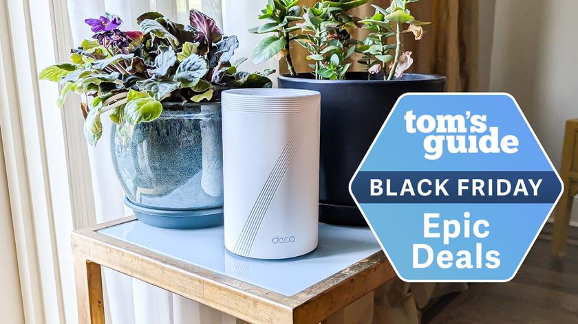 The TP-Link Deco BE67 mesh router on a table with a Tom&#039;s Guide Black Friday deals badge