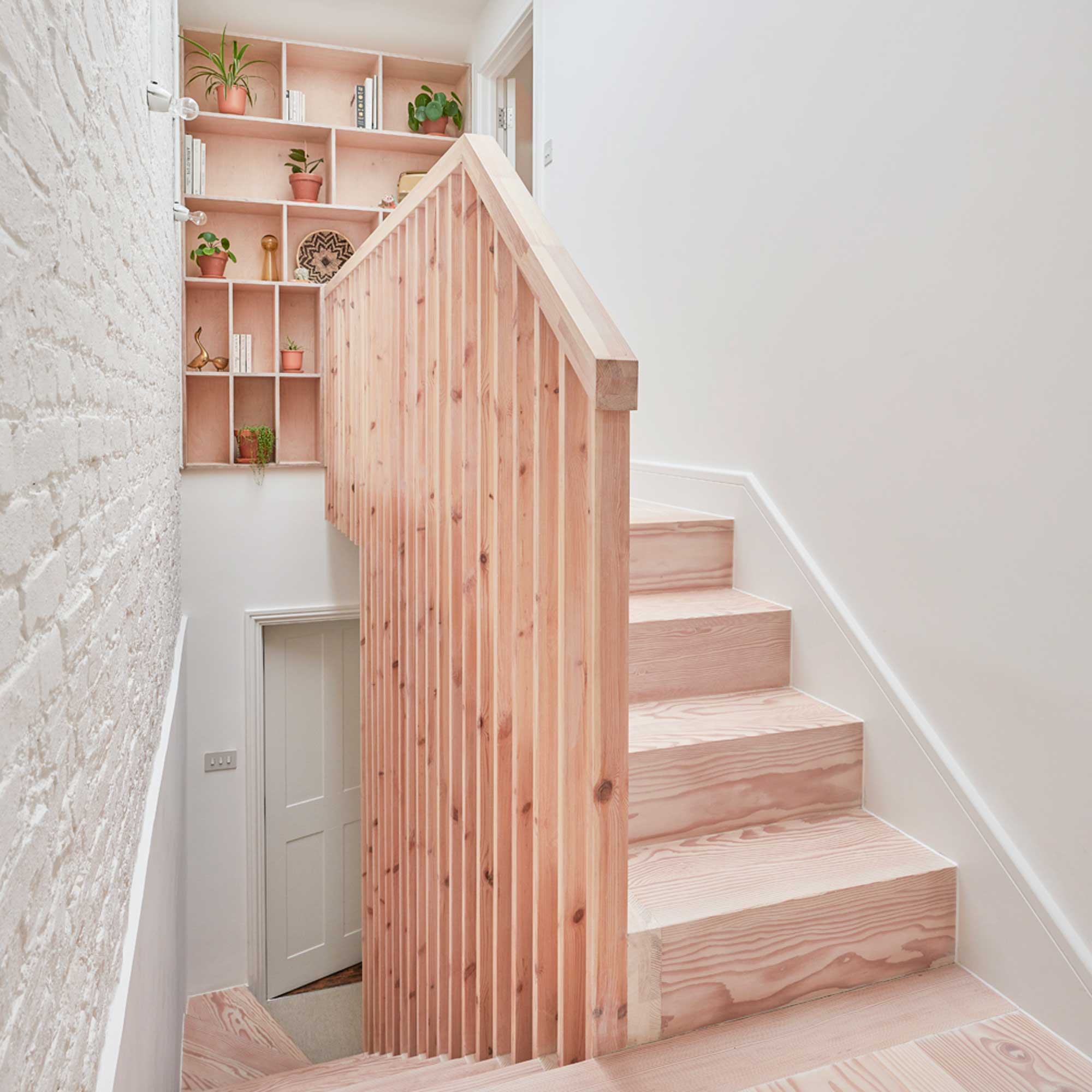 bare wooden loft conversion staircase with storage