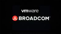 VMware and Broadcom logos displayed on a laptop screen against a black background.