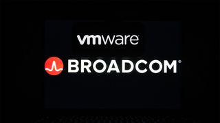 VMware and Broadcom logos displayed on a laptop screen against a black background.