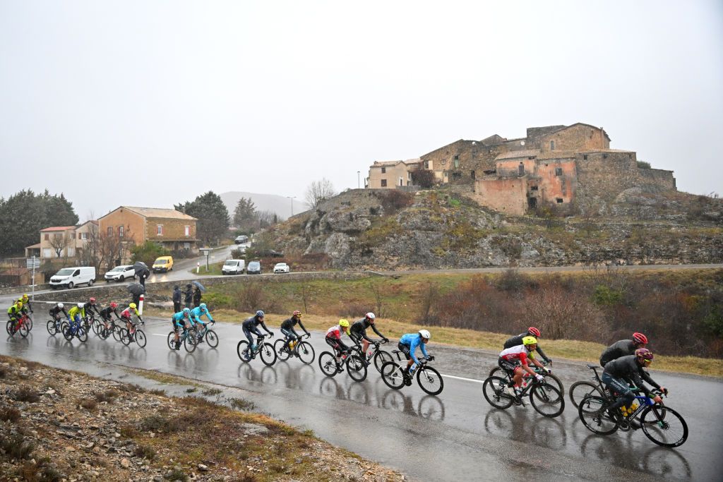 Peloton races on a wet day on stage 2 from Forcalquier to Manosque