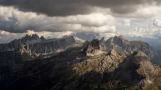 A landscape photo of the Dolomites under cloudy skies
