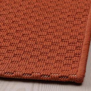 Japandi rust colored rug by IKEA