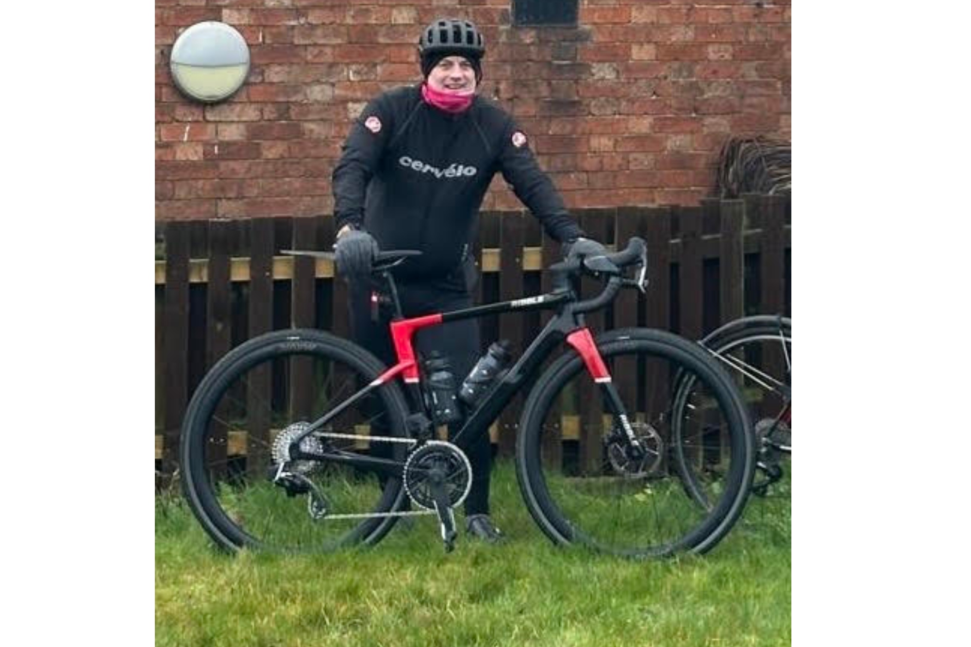 Kevin Frost stands with his bike dressed ready for a winter ride