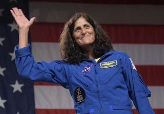 Astronaut Suni Williams waves after being introduced as one of the "Commercial Crew Nine" astronauts on Aug. 3, 2018.