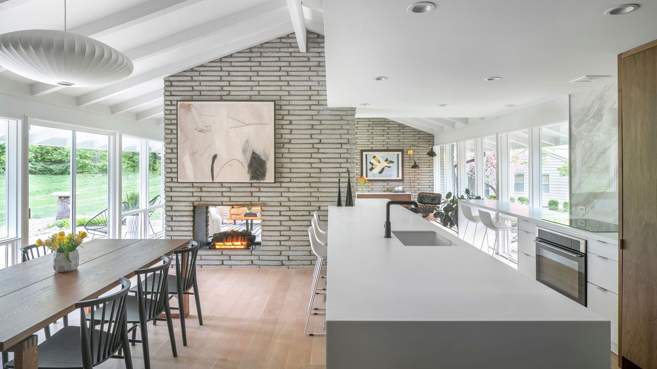 a mid century home with a long kitchen island