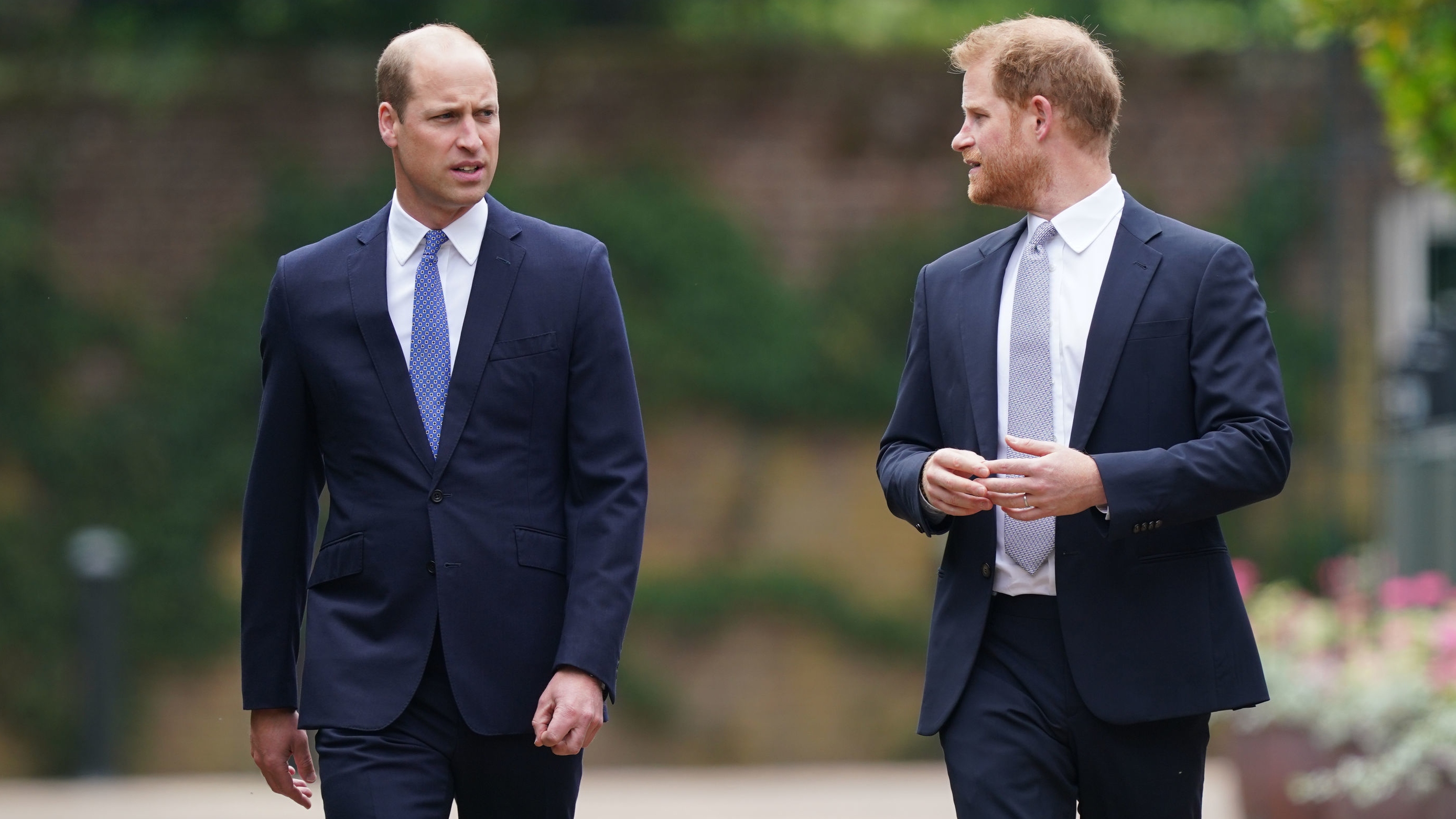 Prince William and Prince Harry arrive for the unveiling of a statue they commissioned of their mother Diana, Princess of Wales