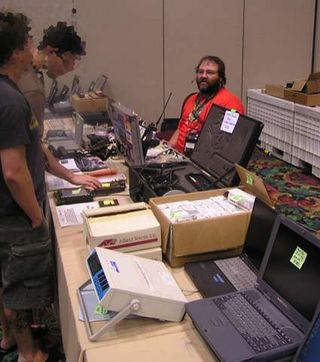 Surplus electronics vendor in the vendor room. Photo courtesy of Robert McLaughlin, InfoSec News.
