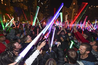 Fans in downtown Los Angeles celebrate the opening of "Star Wars: The Force Awakens"