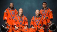 The four male astronauts of NASA's Artemis 3 mission in a portrait wearing their orange spacesuits. They are: Andre Douglas, Luca Parmitano, Randy Bresnick and Frank Rubio.