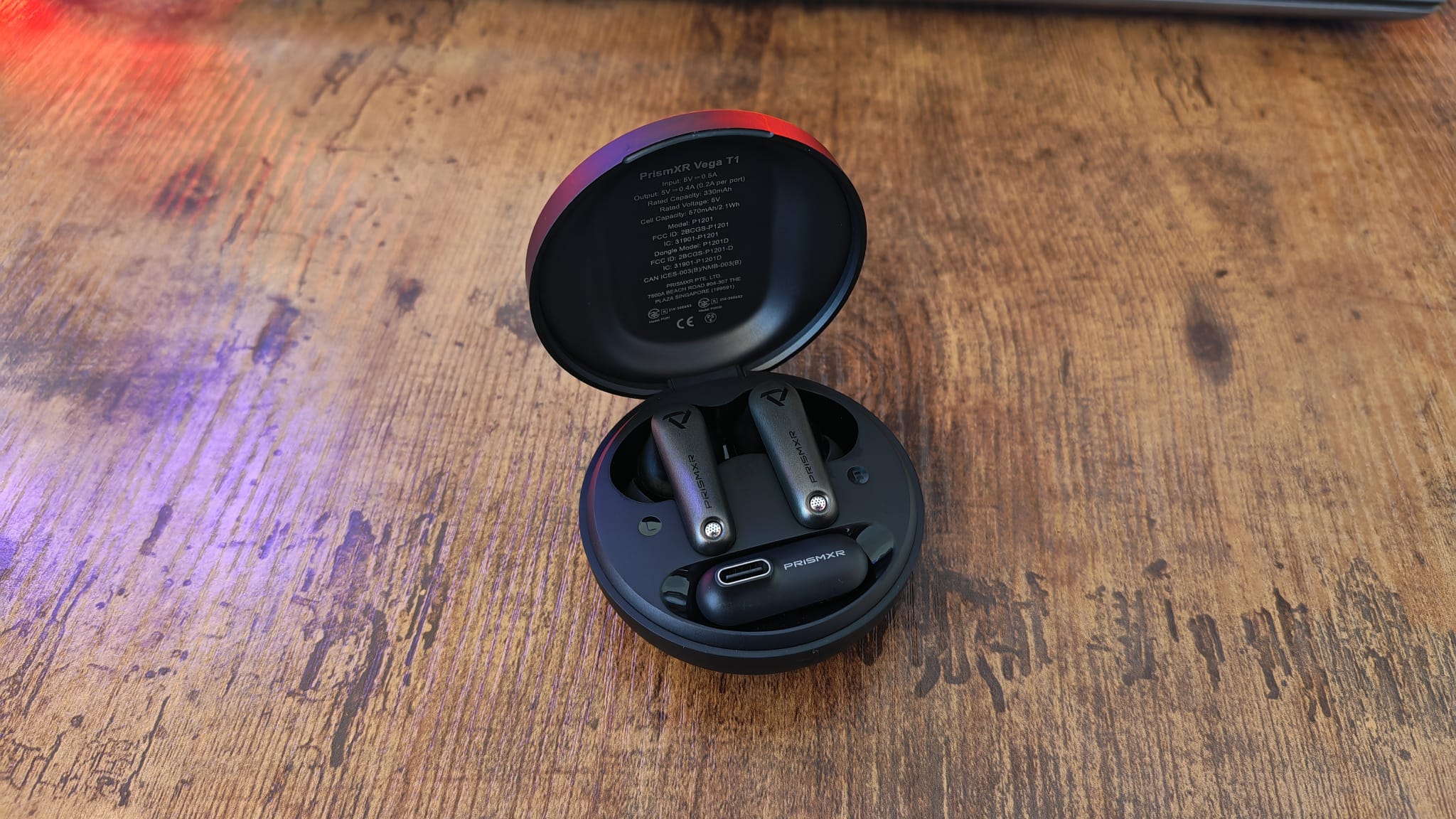 The open case for the PrismXR Vega T1 earbuds