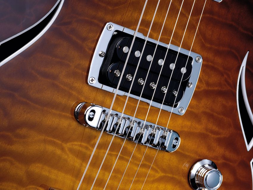 The bridge has roller saddles to help tuning stability with the Bigsby vibrato