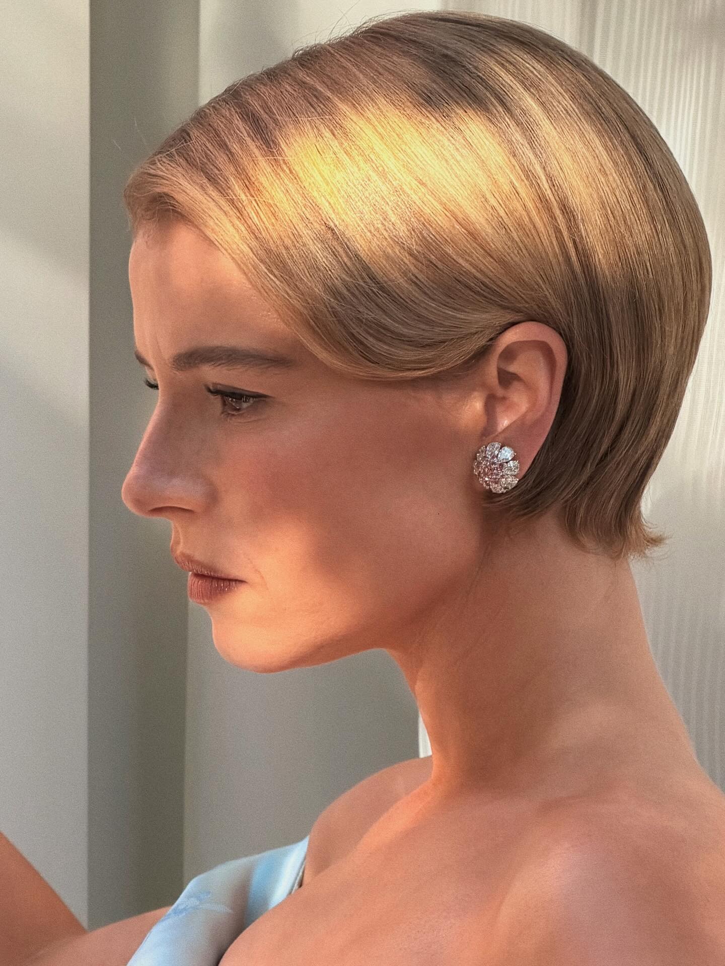 A close-up of Jessie Buckley's golden blonde bob hairstyle