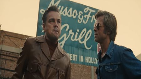 Rick Dalton (Leonardo DiCaprio) and Cliff Booth (Brad Pitt) have a conversation in Once Upon a Time in Hollywood.